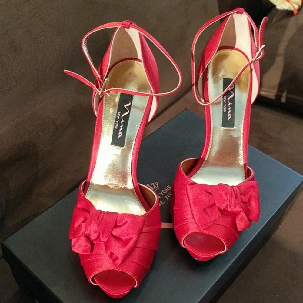 Red satin Nina platform heels with bows